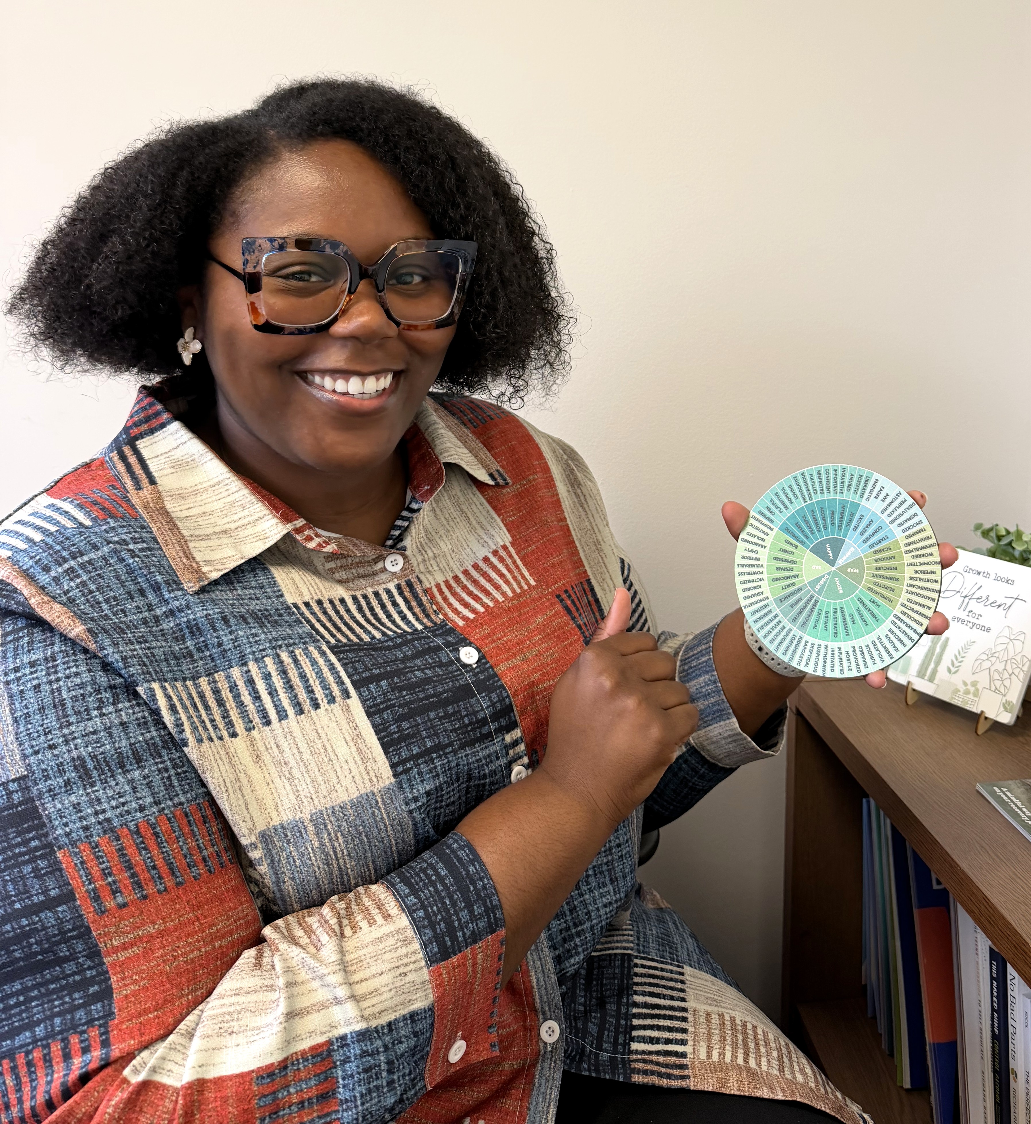 Woman holding feelings wheel